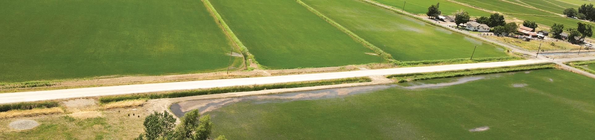 Aerial photo of unpaved commercial industrial roads in an agricultural landscape