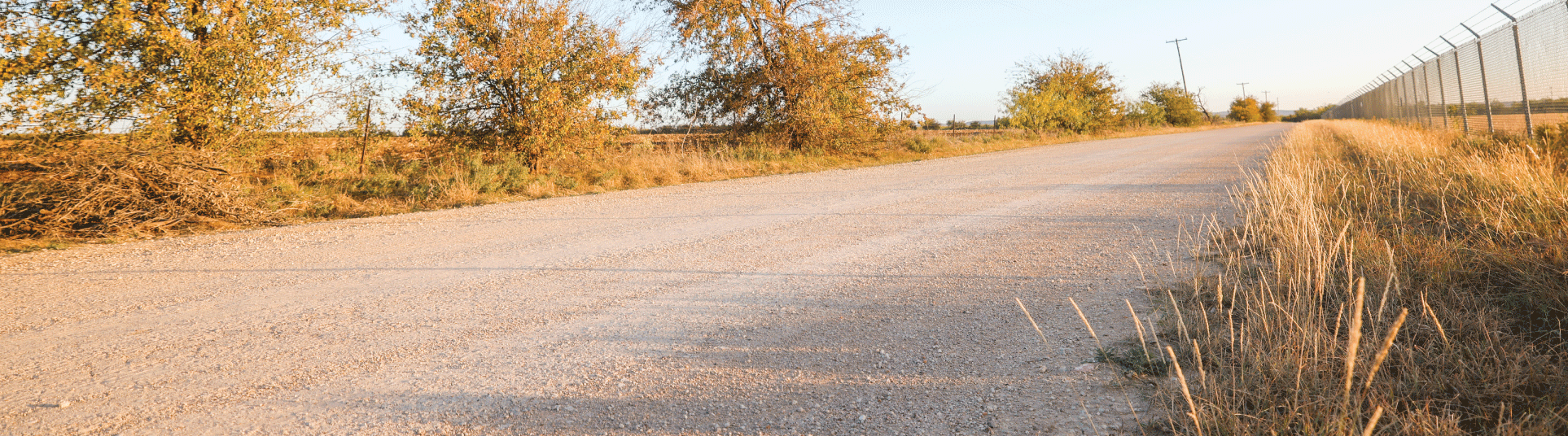 Unpaved, Perma-Zyme treated road in a rural, heavy industrial area