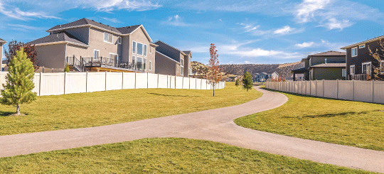 Walking path through a community with multiple residential properties