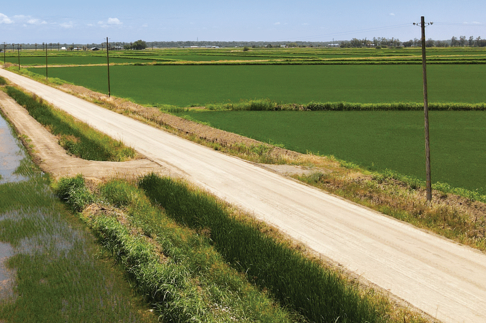 Aerial photo of an unpaved, rural road that heavy industries use